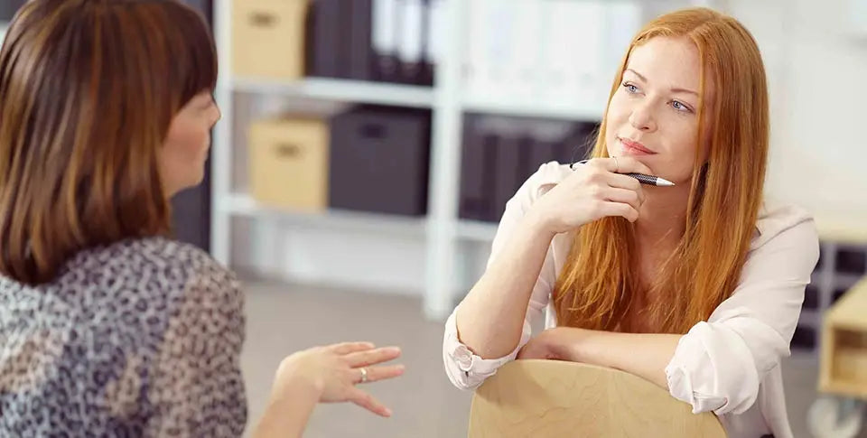 Two colleagues in deep conversation
