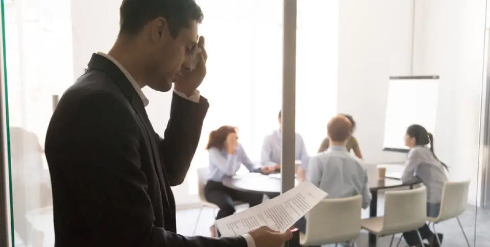 business man reading document, sees bad news