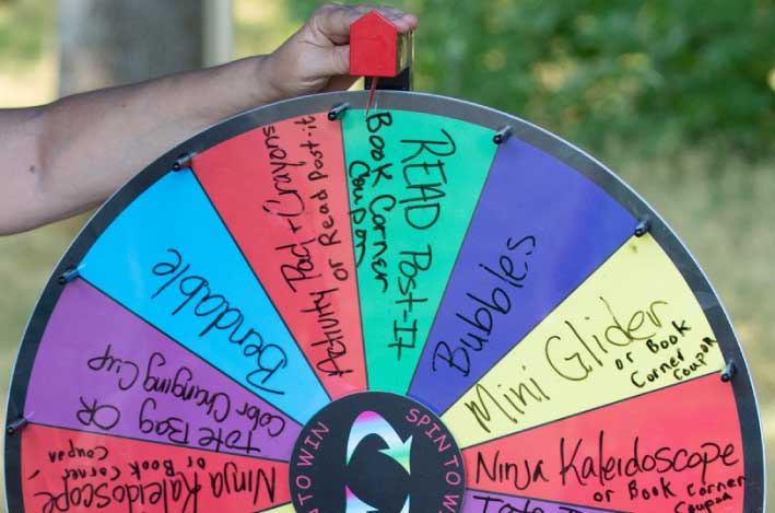 Spinning prize wheel in use at outdoor festival