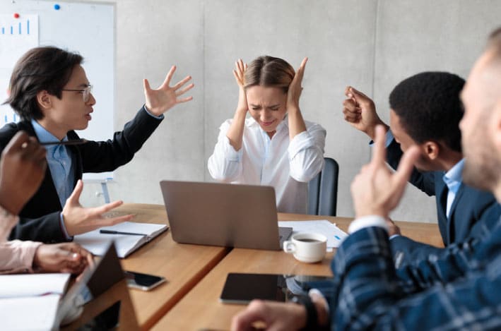 Group having an argument at work. In need of de-escalating difficult conversations