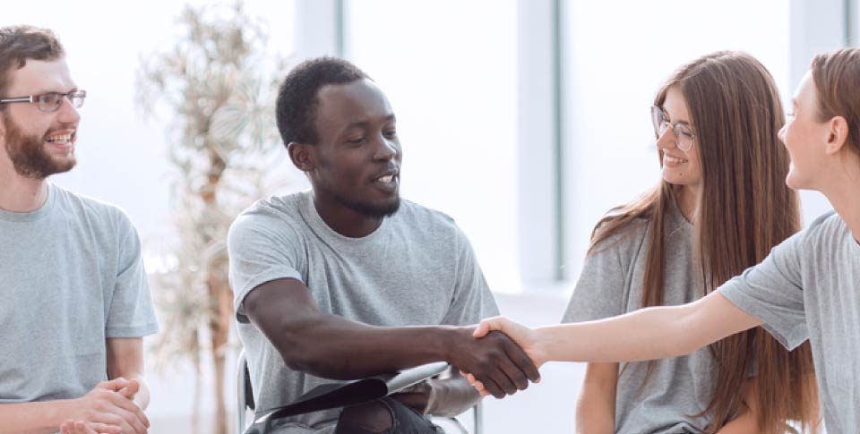 young colleagues shaking hands