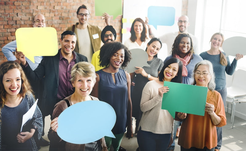 Group gathering at work and exchanging thoughts, symbolized by thought bubbles