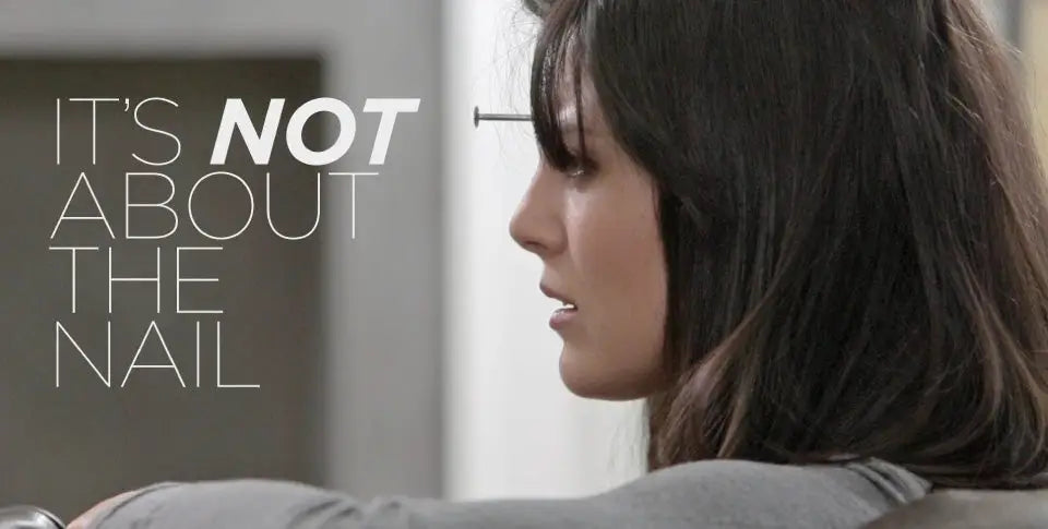 woman with nail in her forehead. Caption: It's NOT about the nail