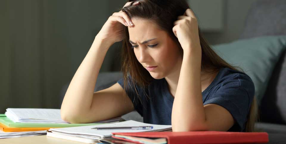 woman looking at notebook, concentrating