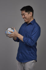 Man looking at Workplace Ethics Thumball prompt