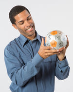 Man reading prompt on Which are You and Why? Thumball