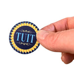'Round TUIT Tokens in hand