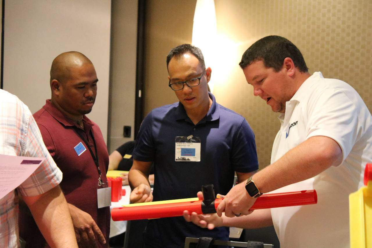 Mta Team Kit men standing and building