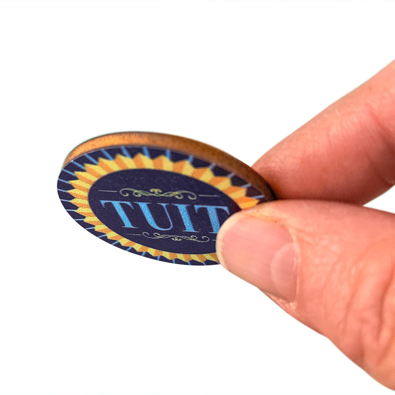 'Round TUIT Tokens, in hand to show depth