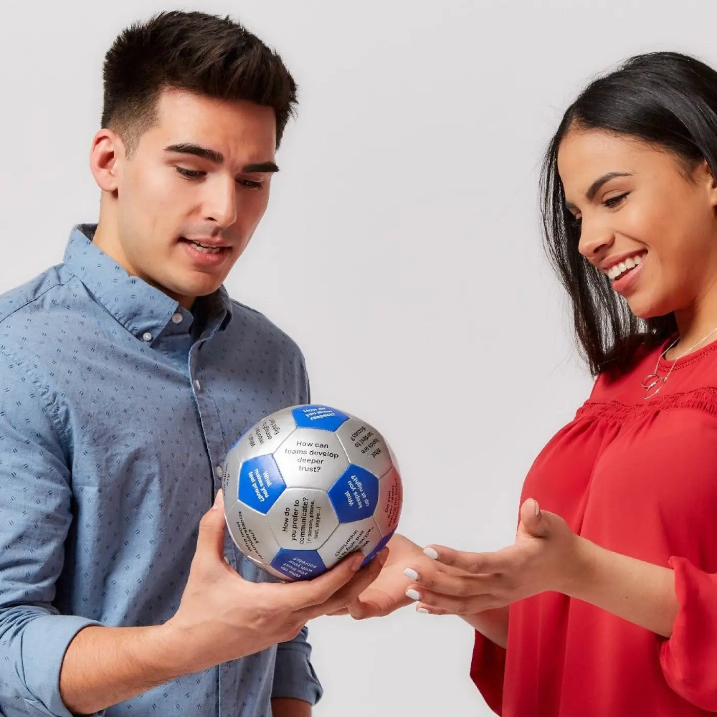 Man and woman using Building TrustThumball