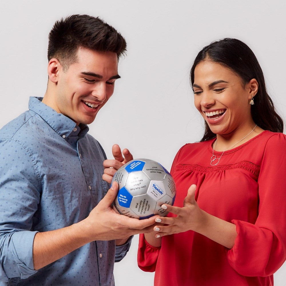 Man and woman using Building Trust Thumball