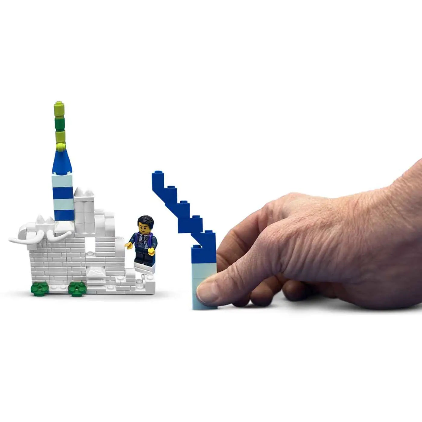 Person adding blue LEGOs to the white structure