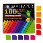 A pack of 100 origami paper sheets in rainbow colors, shown in a black box with colorful diagonal paper samples and small folded paper swatches on a white background.