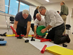 Mta Team Kit Men kneeling and building