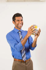 Man holding Shaped by Our Past Thumball