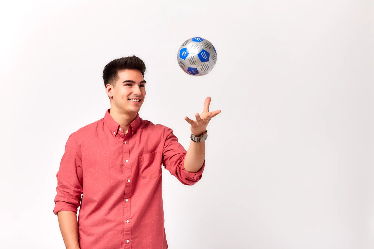 A silver and blue soccer ball with hexagonal panels.