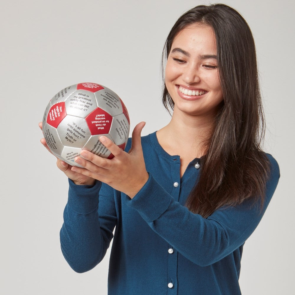 Woman looking under thumb at Toolbox Talks Thumball