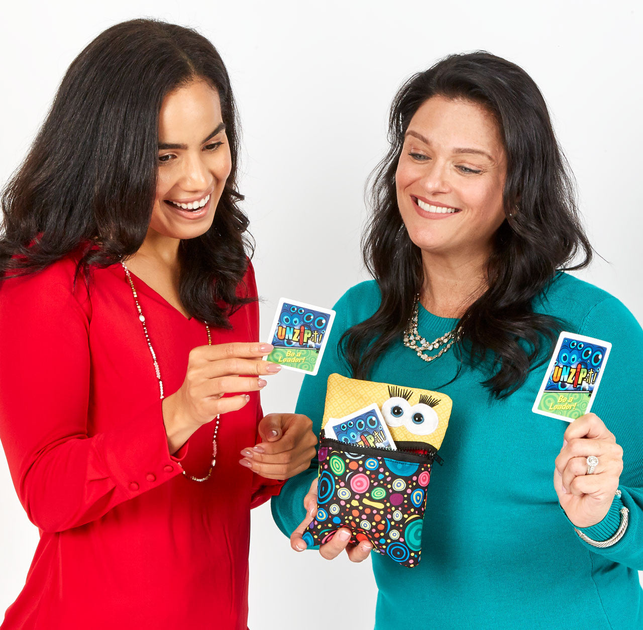 Two women using  UNZiP-it! cards