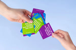 We Connect Cards - Conversation Deck - Trainers Warehouse - hand choosing one card from a deck of question cards
